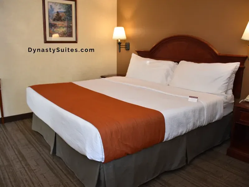 Presidential Suite bedroom with premium bedding and elegant furnishings.
