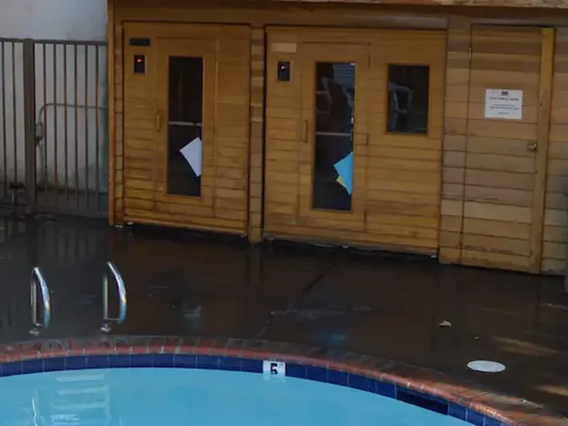Outdoor dry sauna area at Dynasty Suites Redlands.